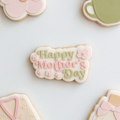 Koekje met Happy Mother's Day in pastel letters en bloemetjes