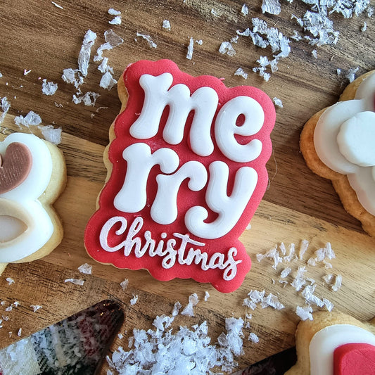 Rood mini koekje met Merry Christmas in witte retroletters
